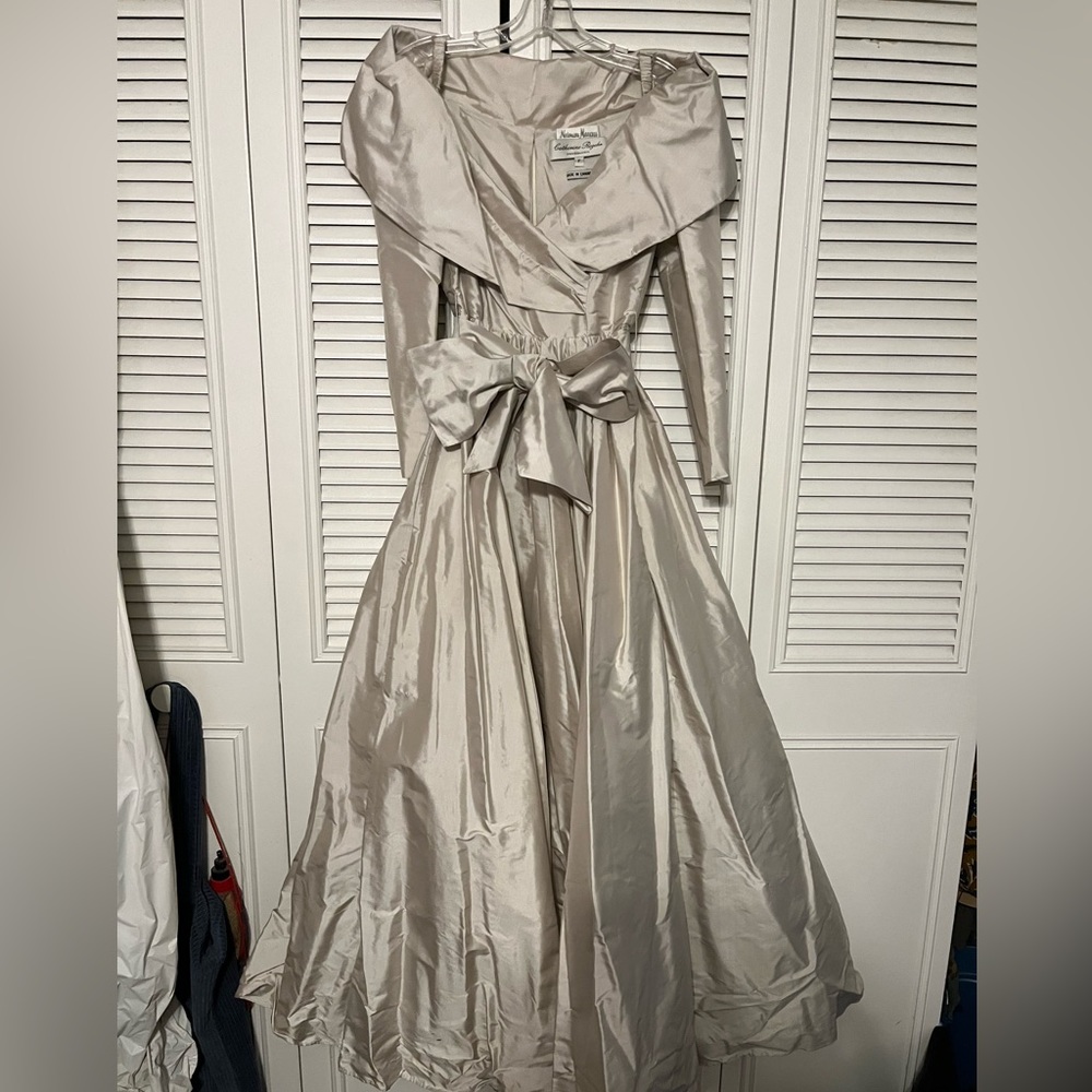 Light grey off the shoulder evening gown with sash and crinoline underskirt